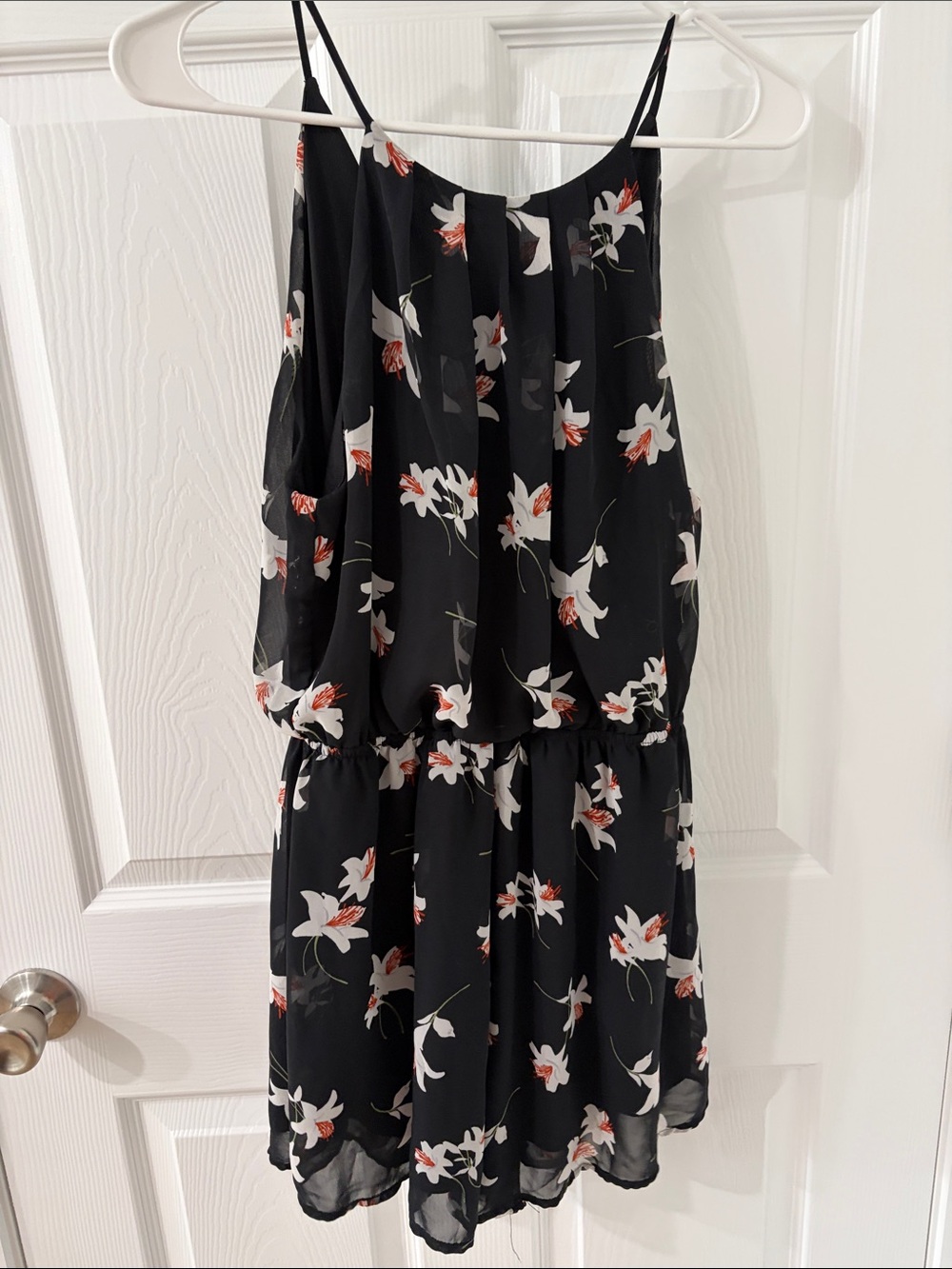 Lush Black Spaghetti-Strap Romper with Subtle Floral Accent